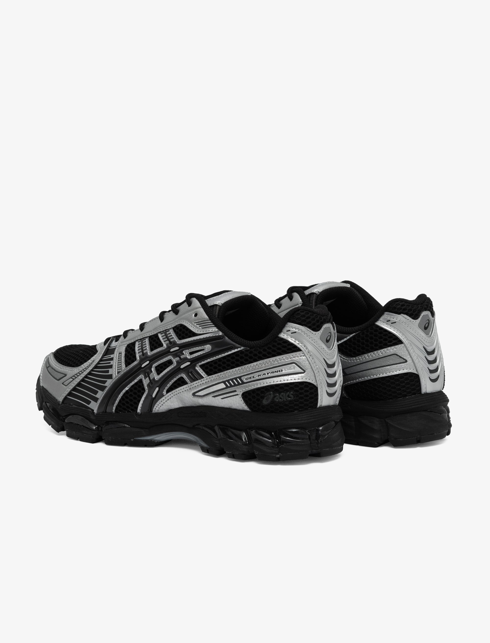 Black and gray running shoes on a white background