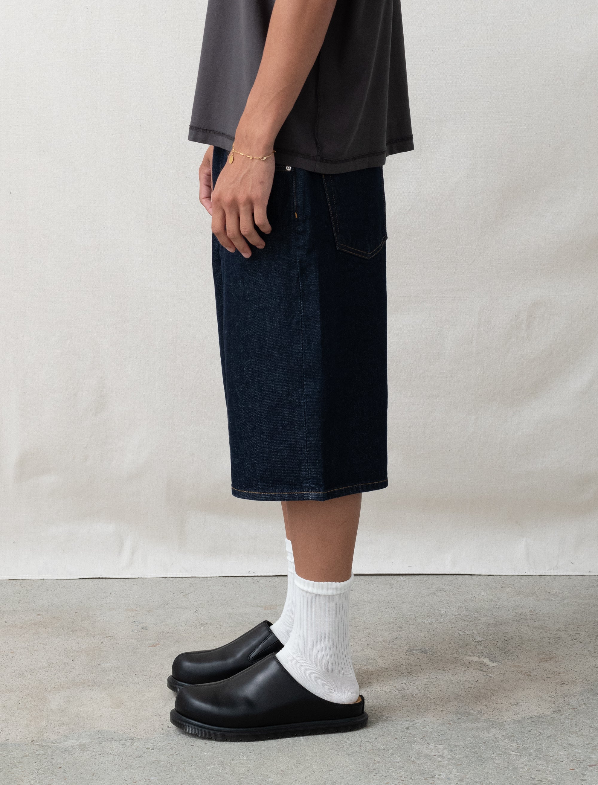 person wearing shorts with a white background