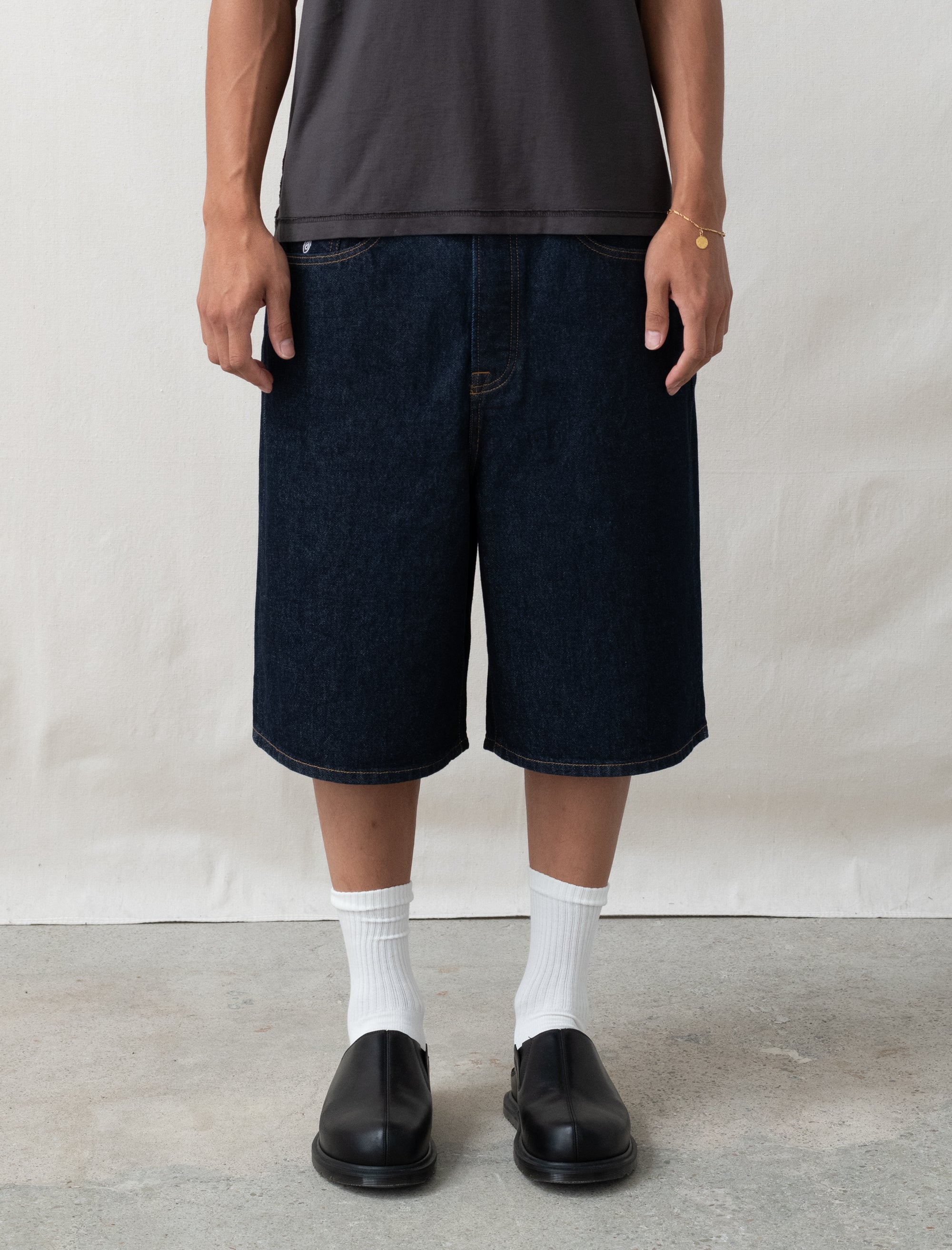 person wearing shorts with a white background