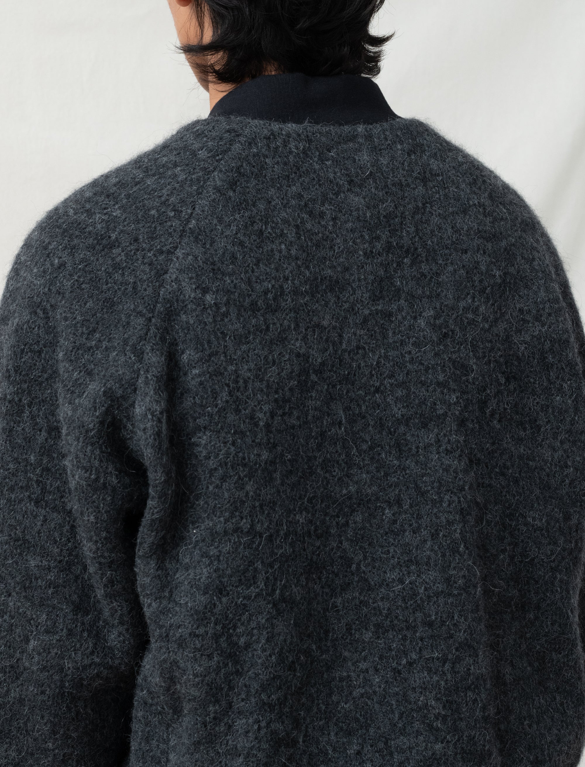 reversible comme bomber in front of white back ground