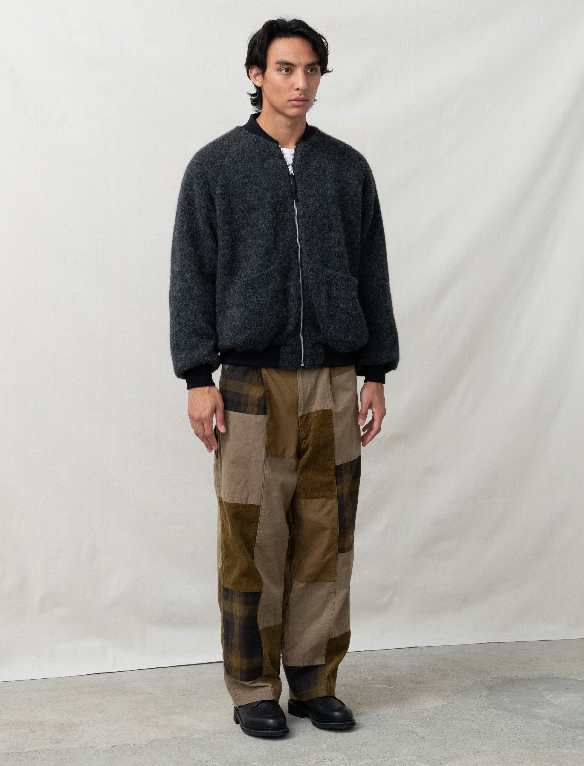 reversible comme bomber in front of white back ground