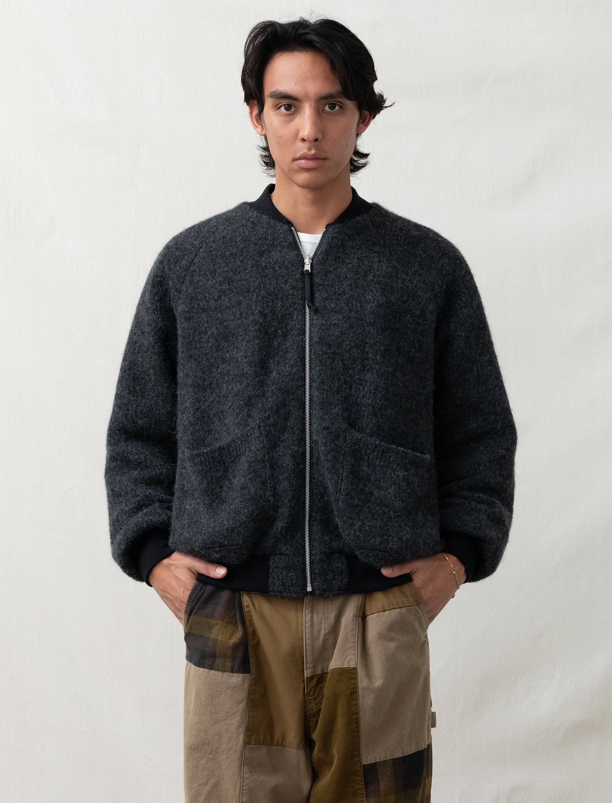 reversible comme bomber in front of white back ground