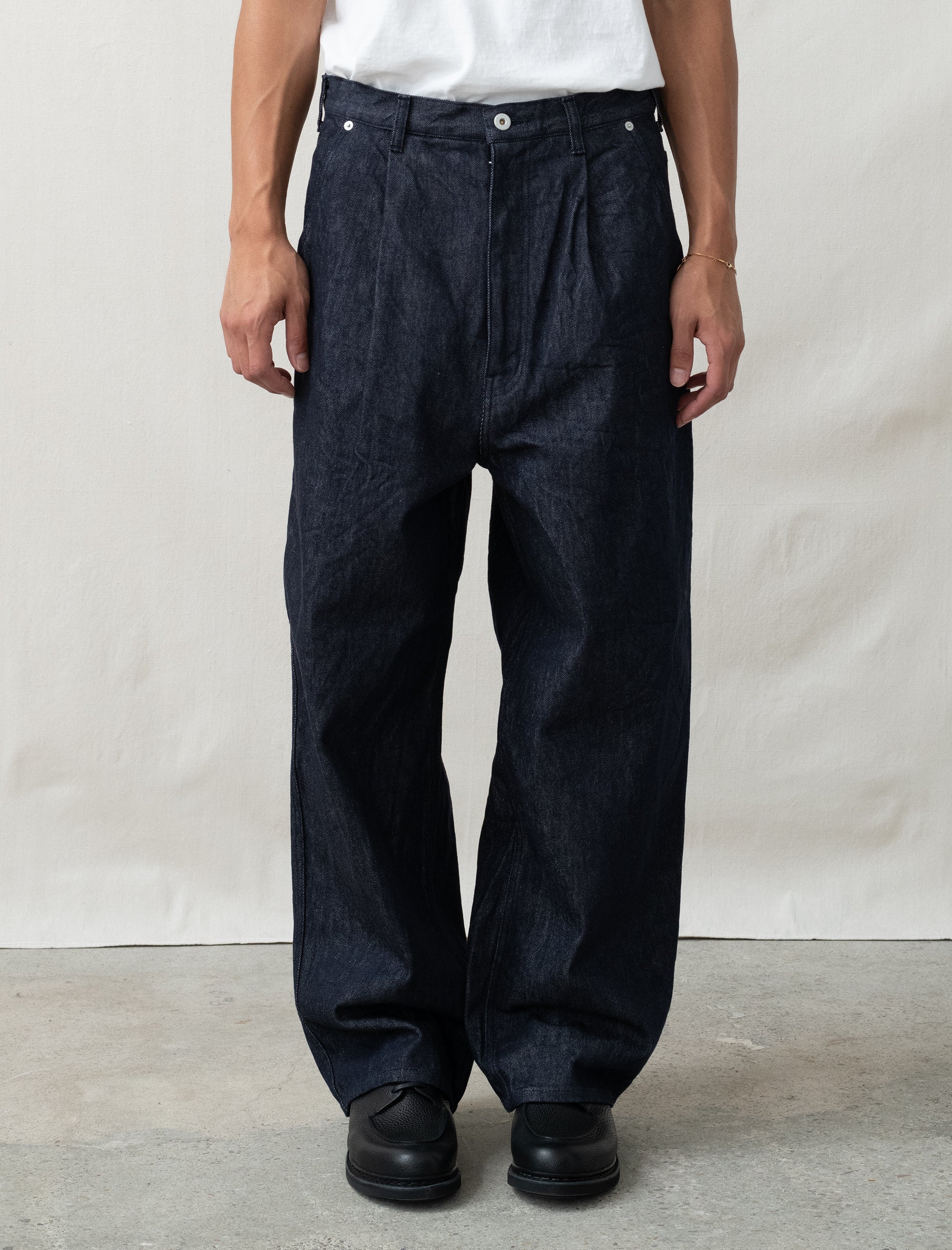 person wearing jeans in front of white background