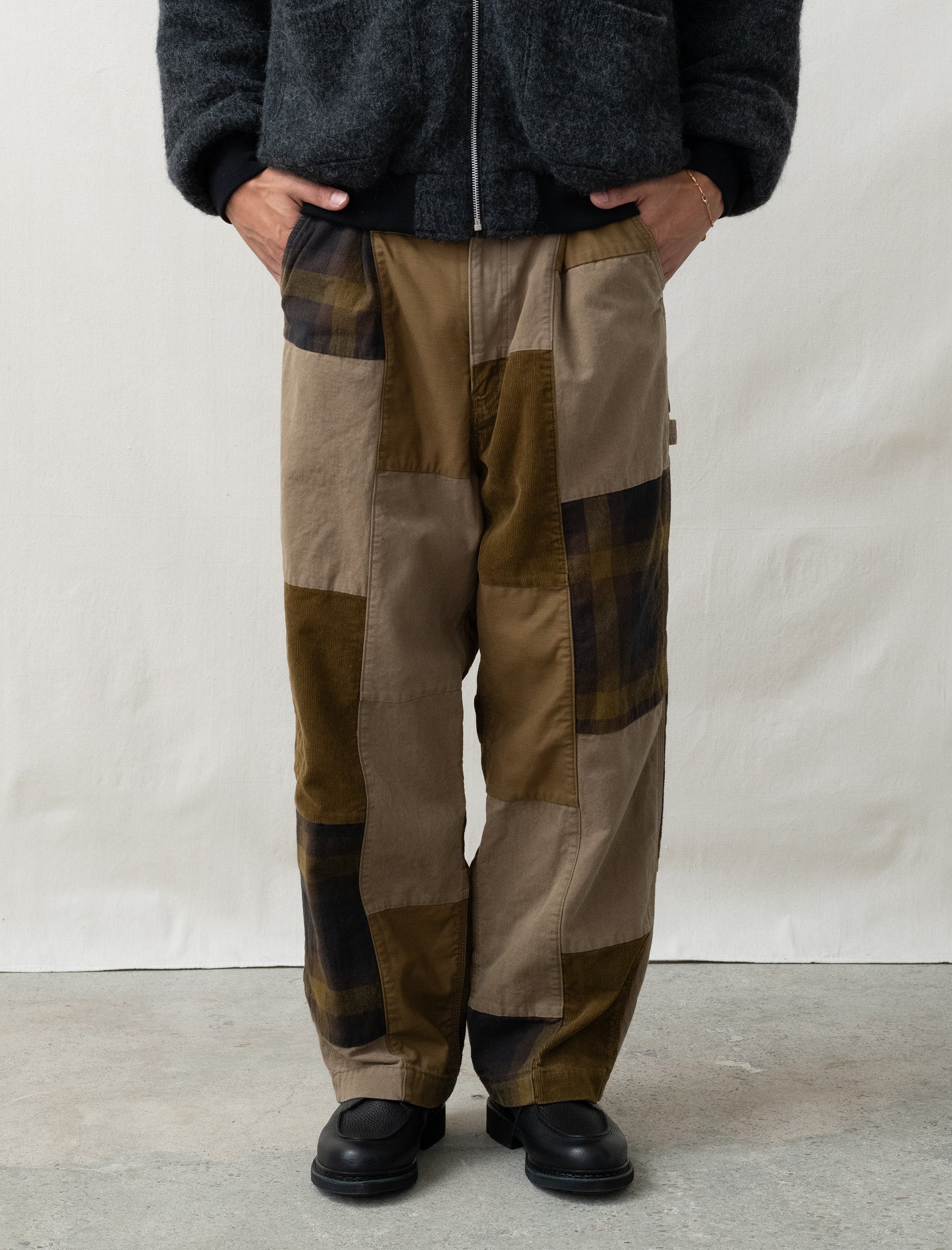 person wearing patchwork pants