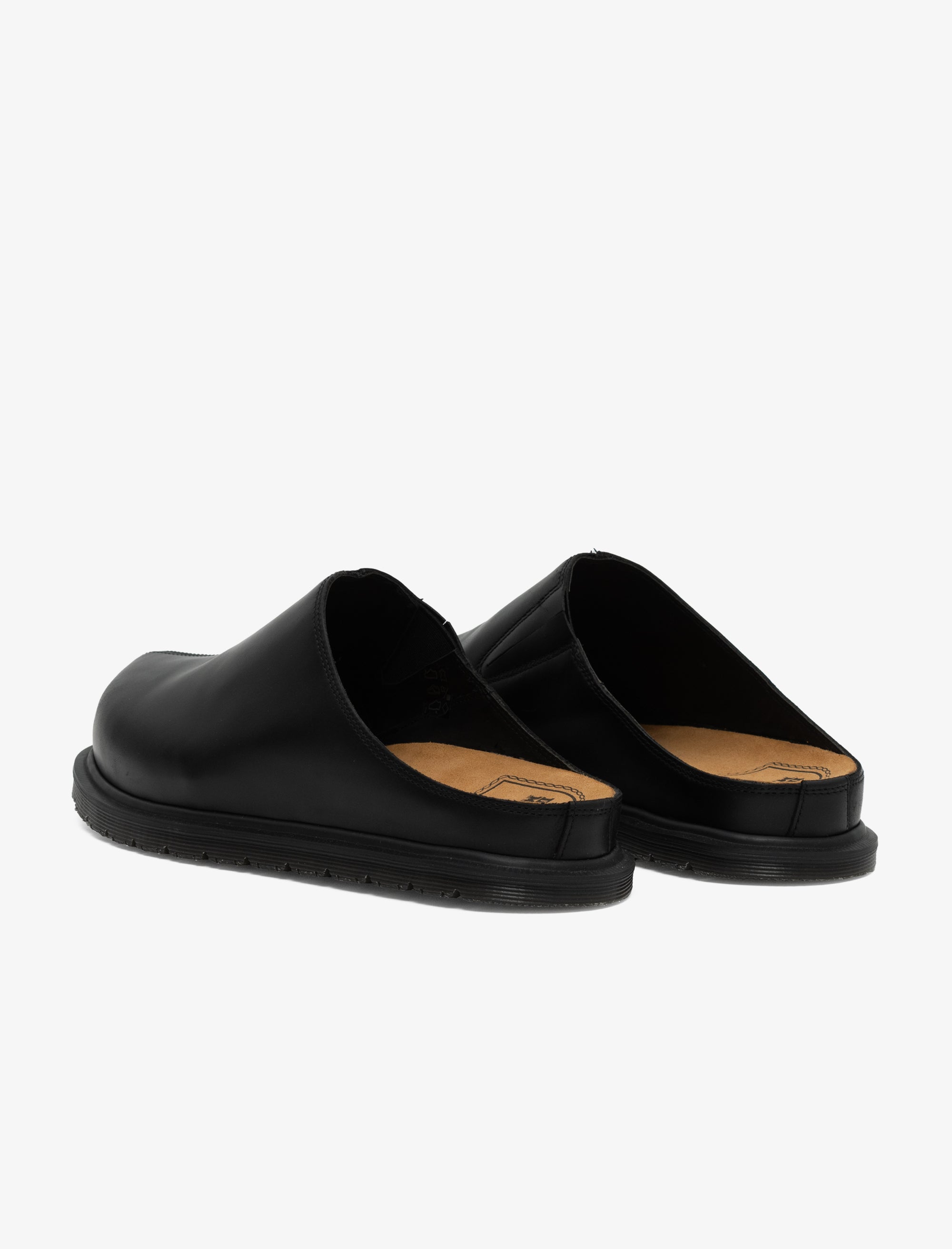 Black slippers with a tan insole on a white background