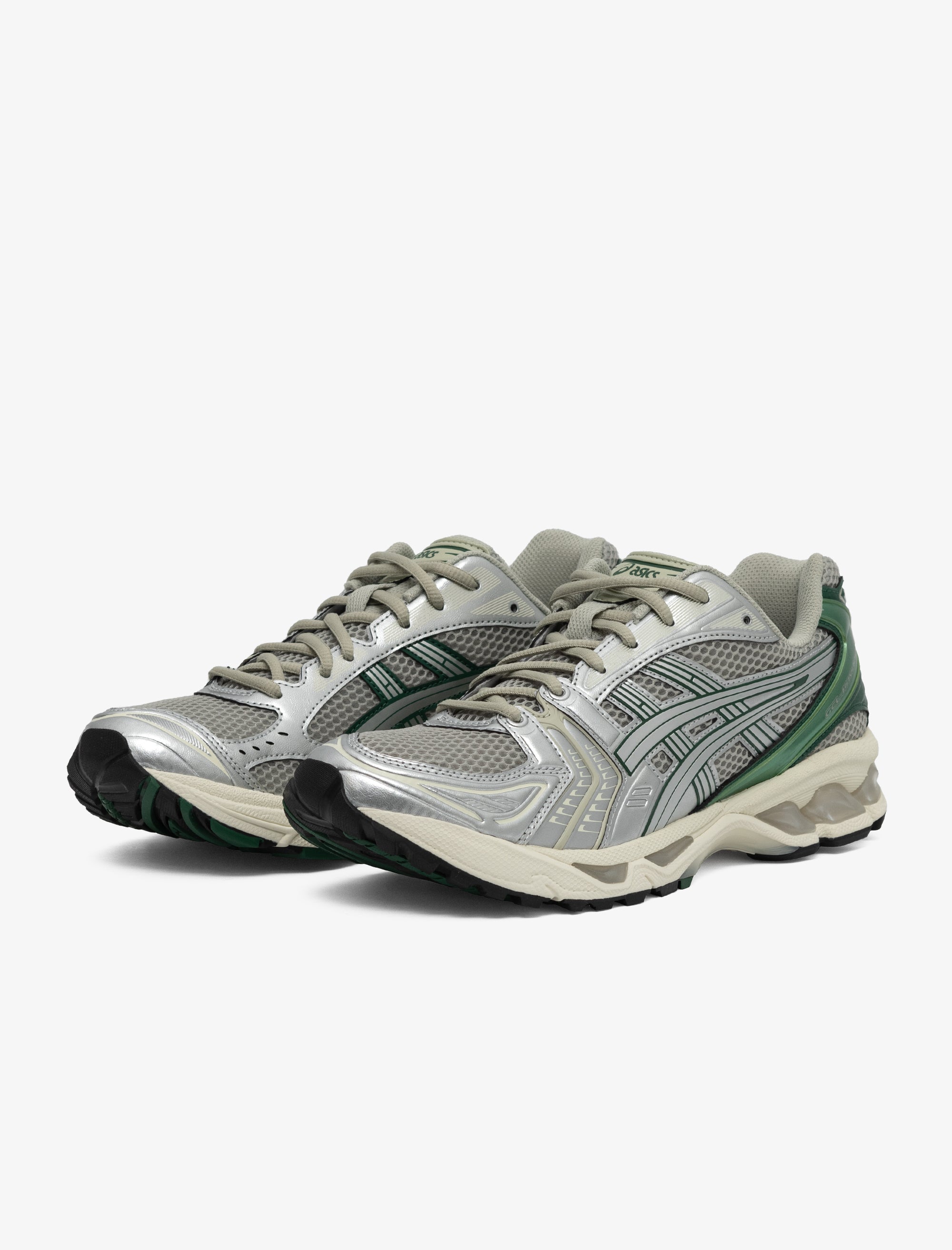 Pair of gray and green running shoes on a white background