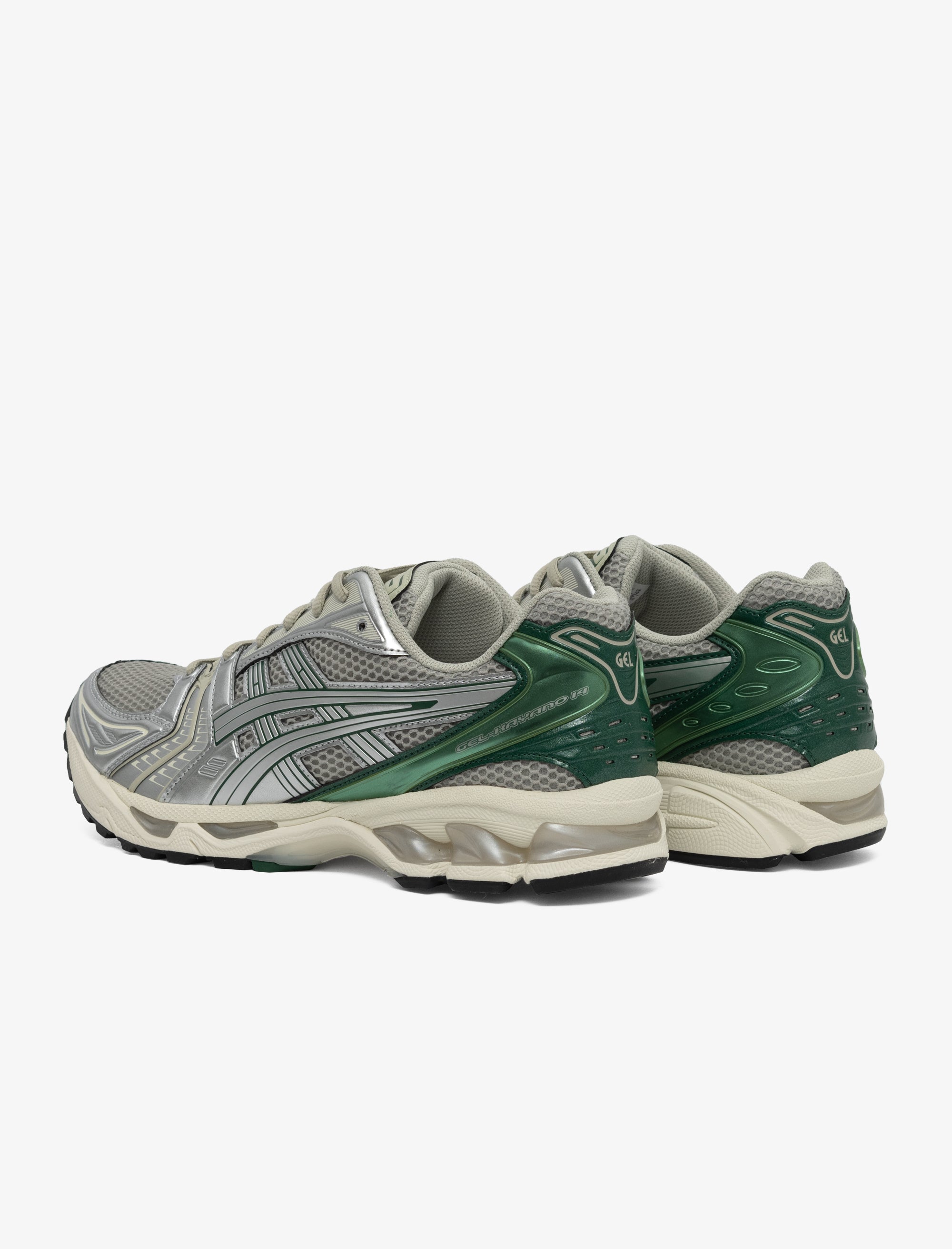 Pair of green and gray running shoes on a white background