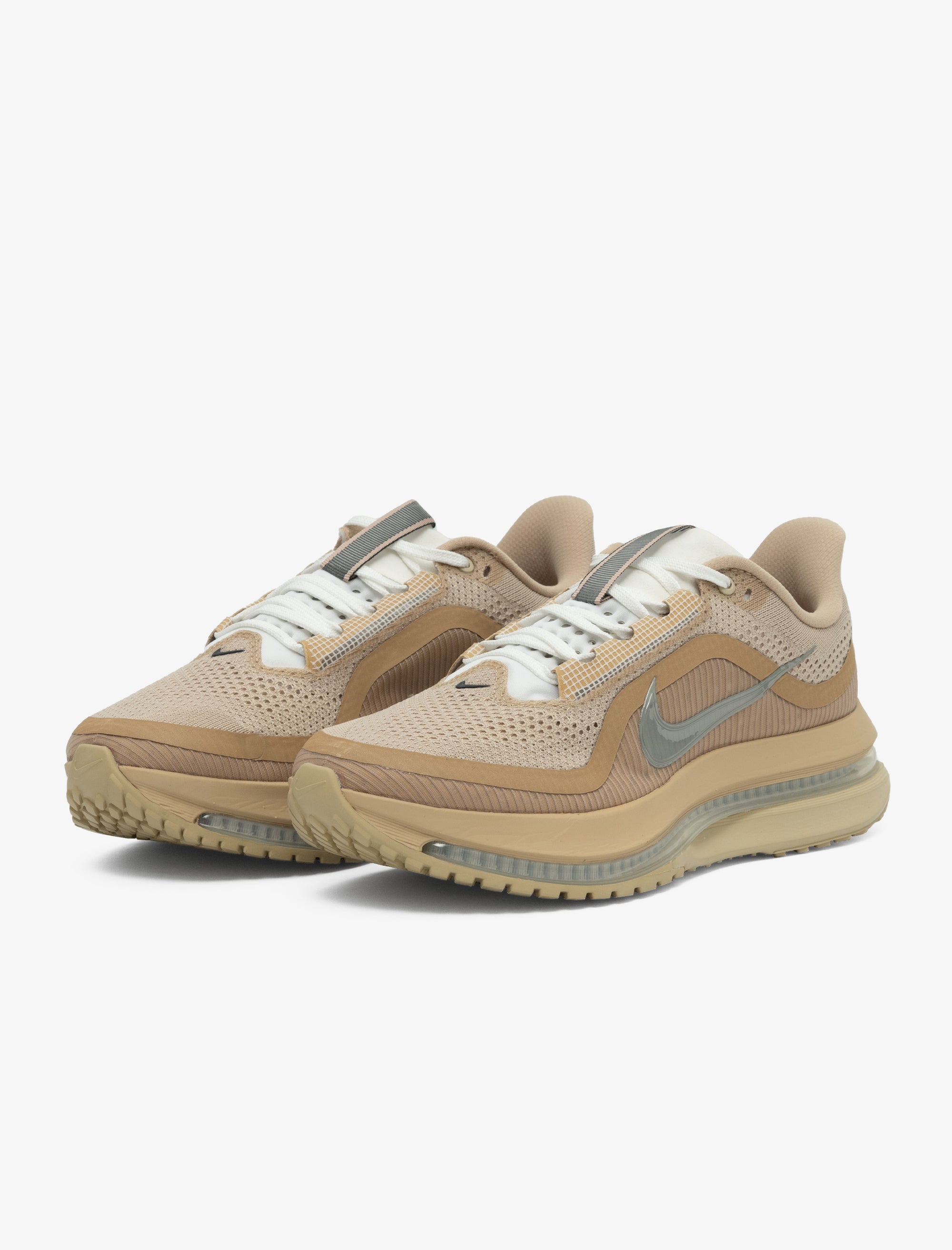 Beige sneakers with a Nike logo on a white background