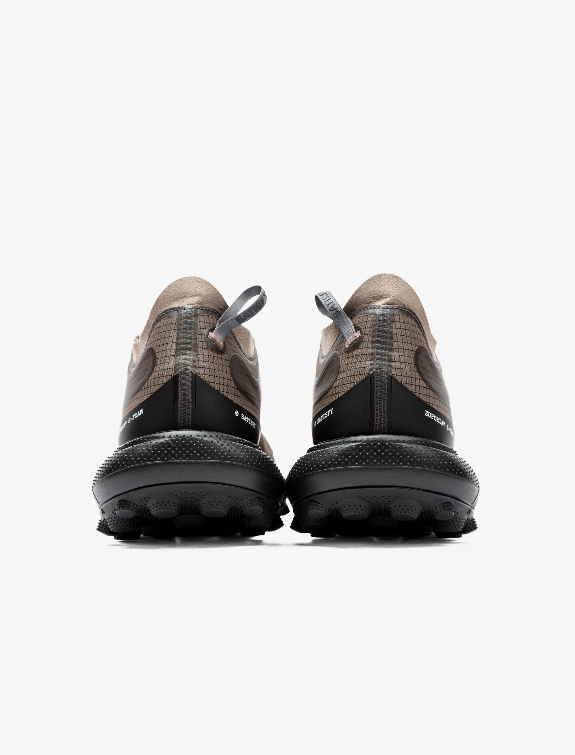 Pair of brown and black shoes on a white background