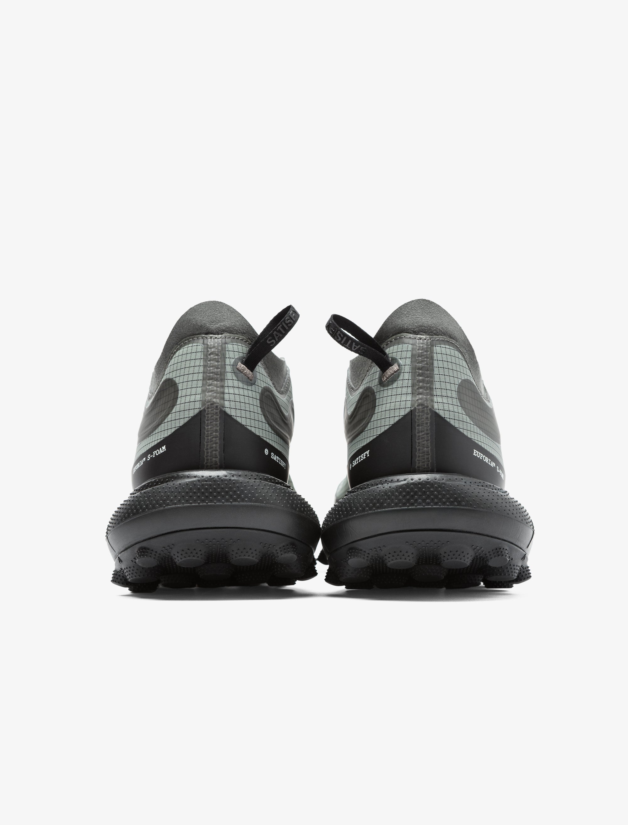 Black and gray hiking shoes with unique sole design on a white background