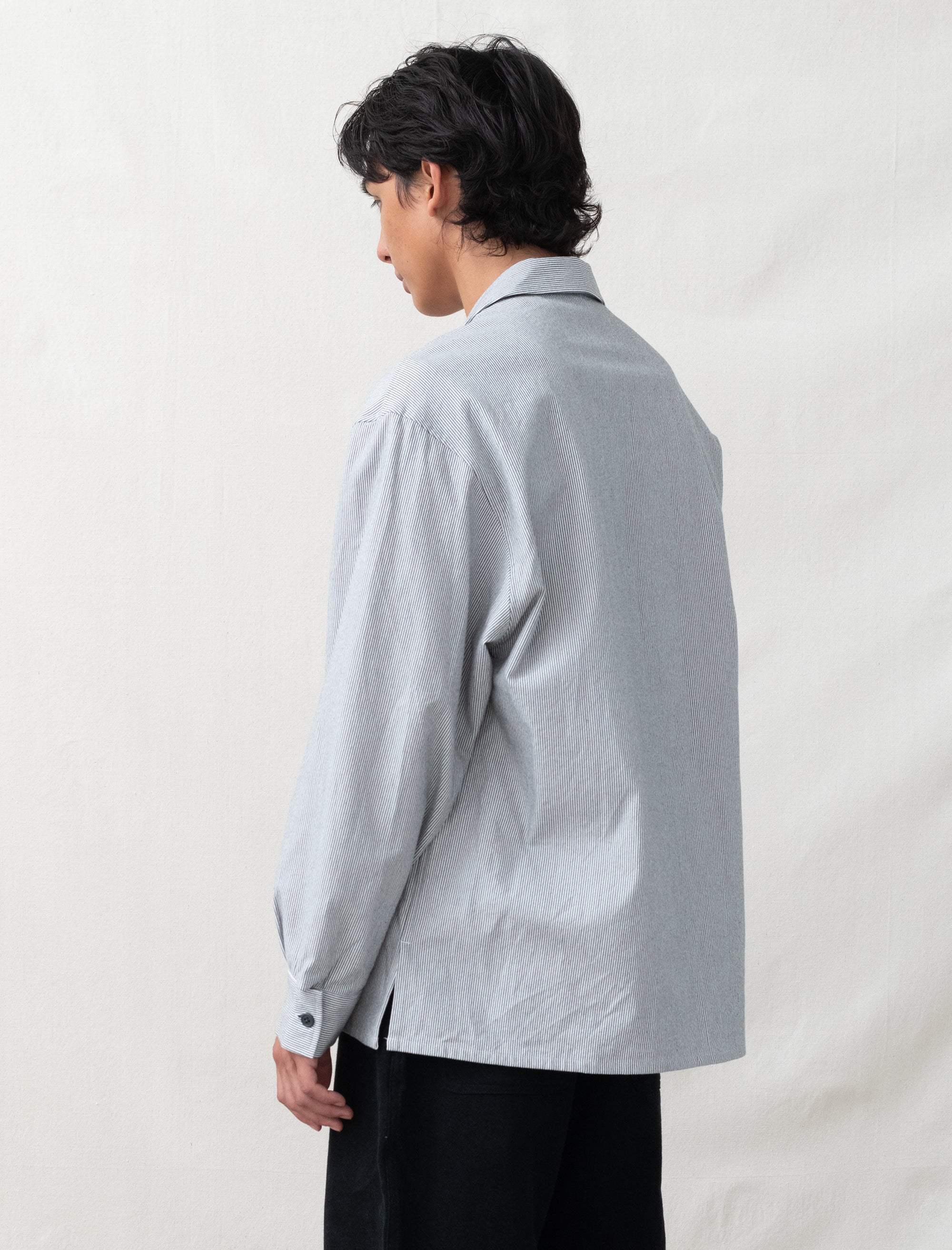model wearing man-tle striped overshirt back view