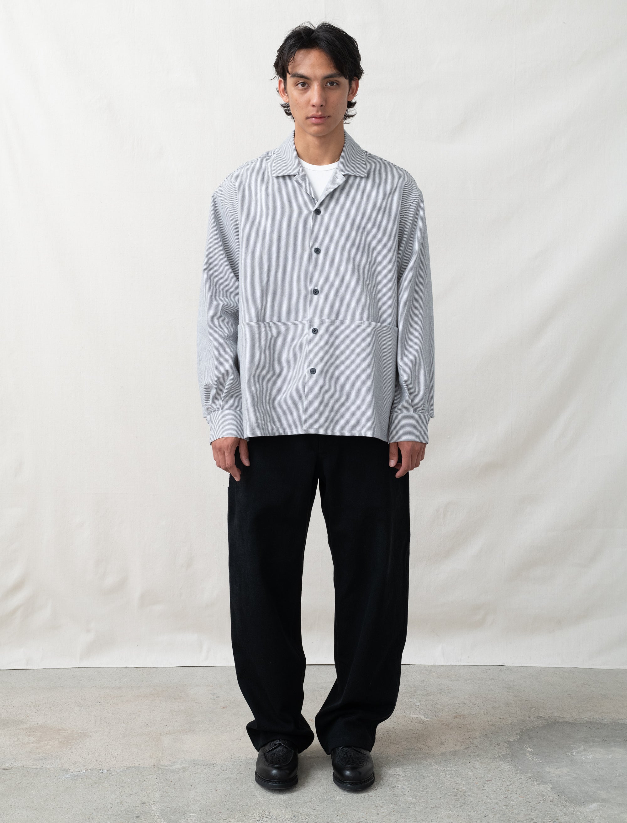 model wearing man-tle striped overshirt full body view