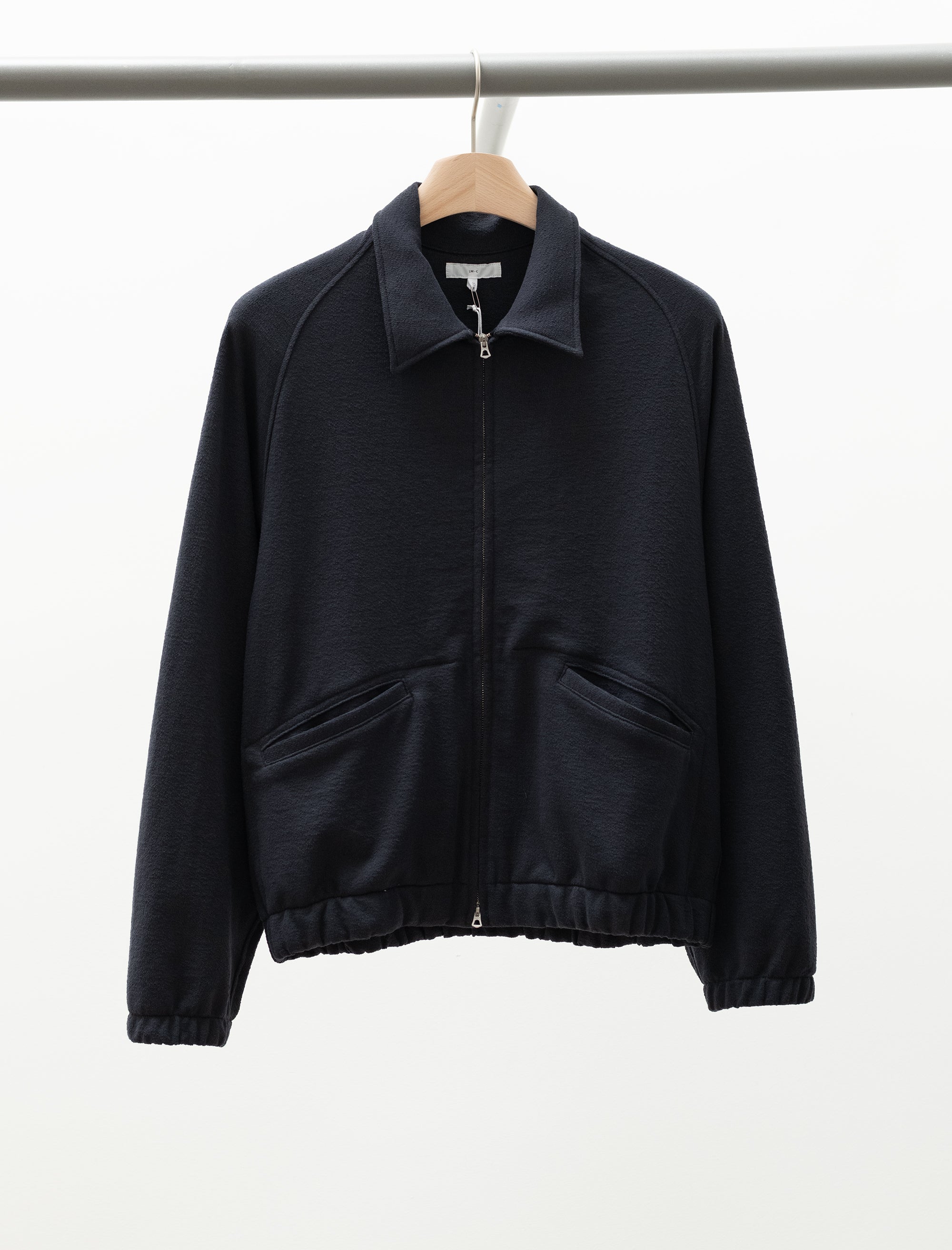 cropped jacket on hanger with white background