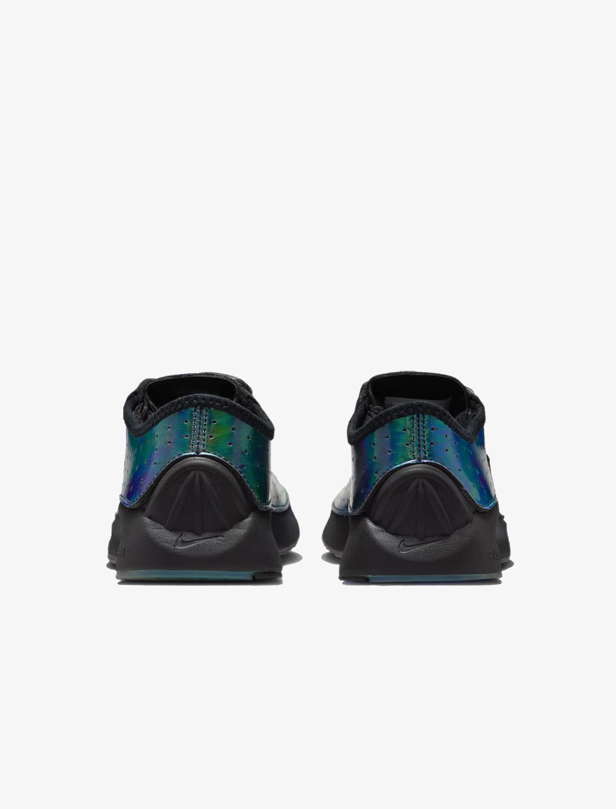 Black and green athletic shoes on a white background