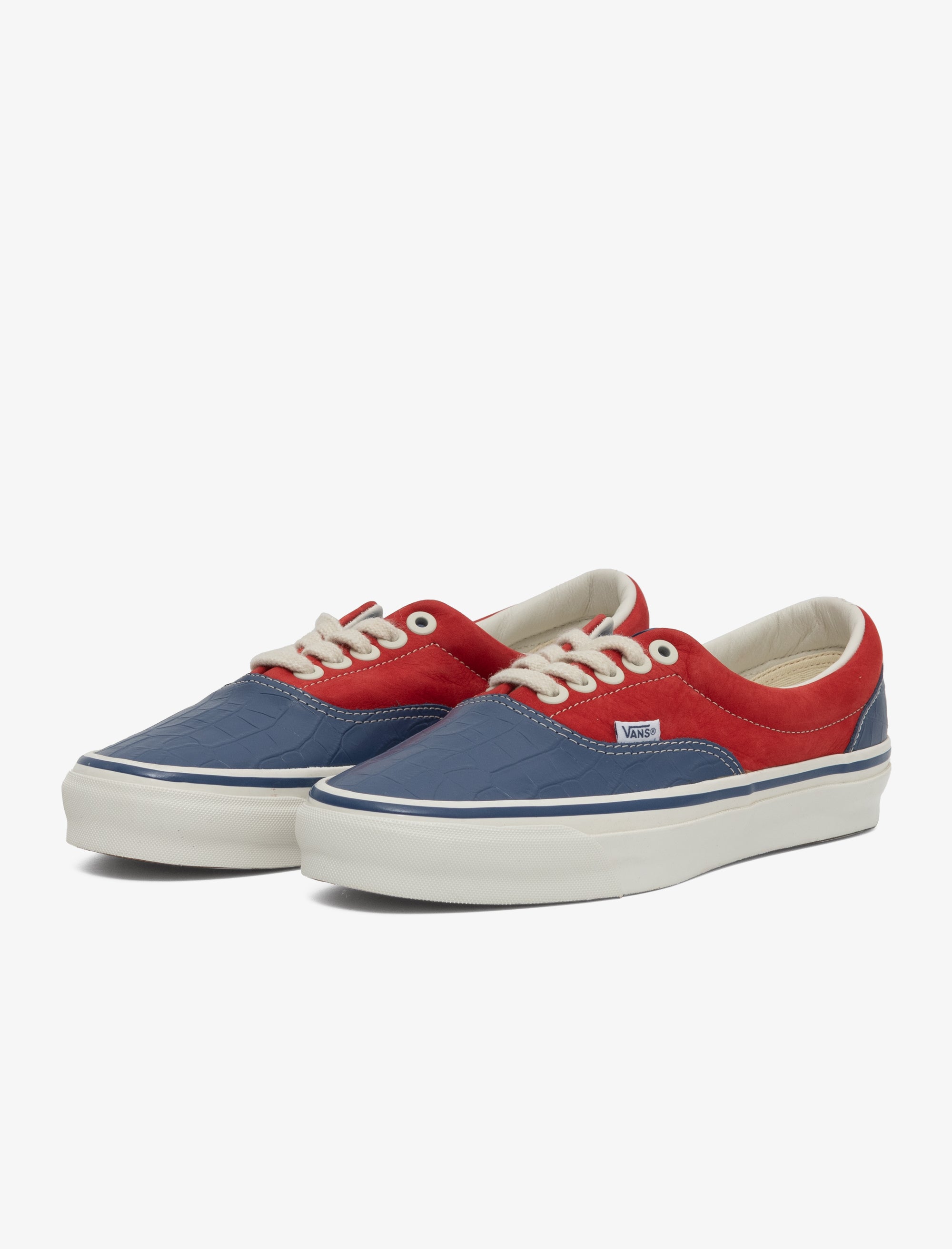 Red and blue sneakers with white laces on a white background