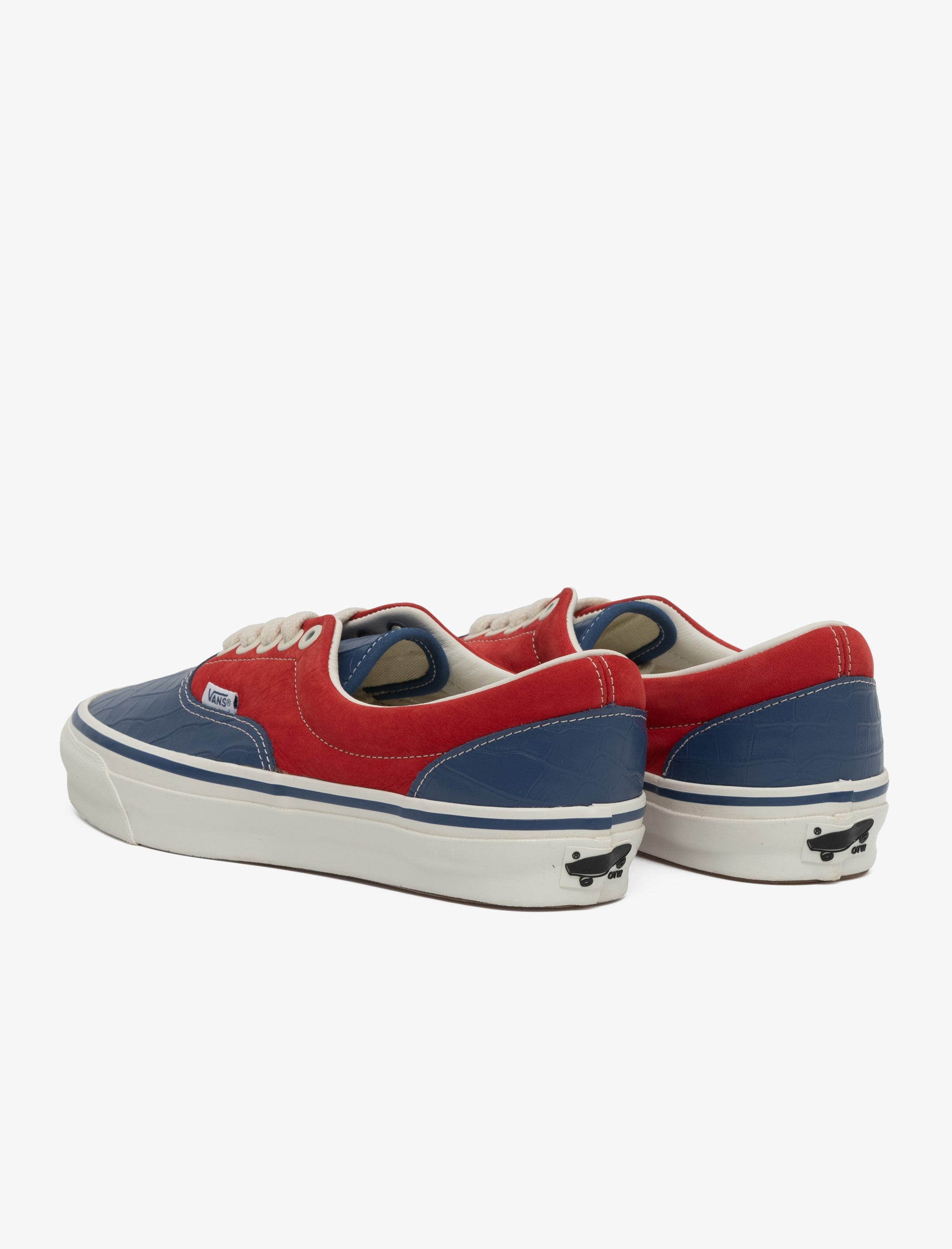 Red and blue sneakers with white soles on a white background