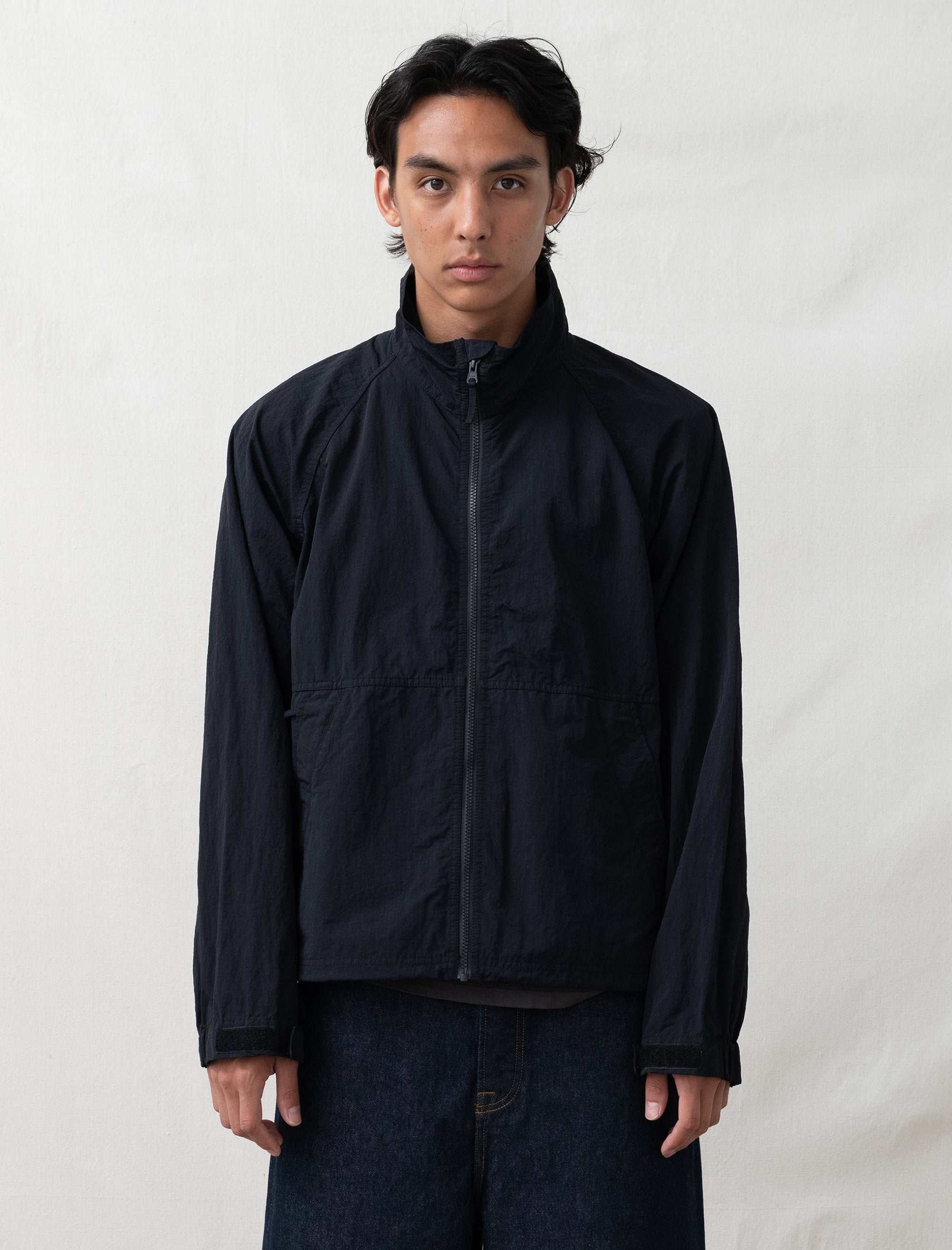 someone wearing a black jacket on white background