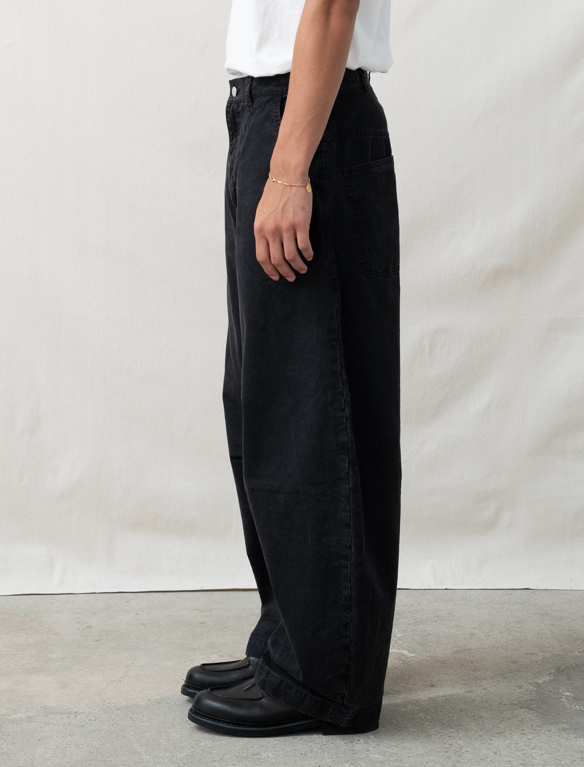 cotton black pants on person in front of white background