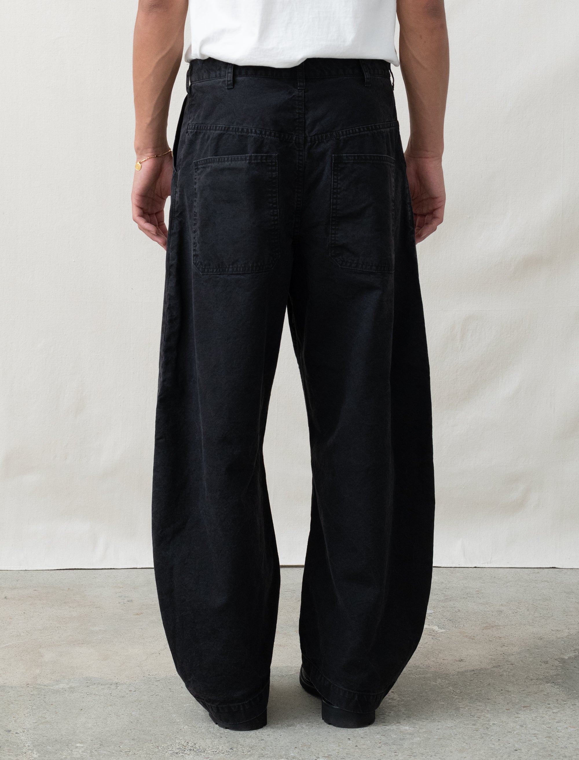 cotton black pants on person in front of white background