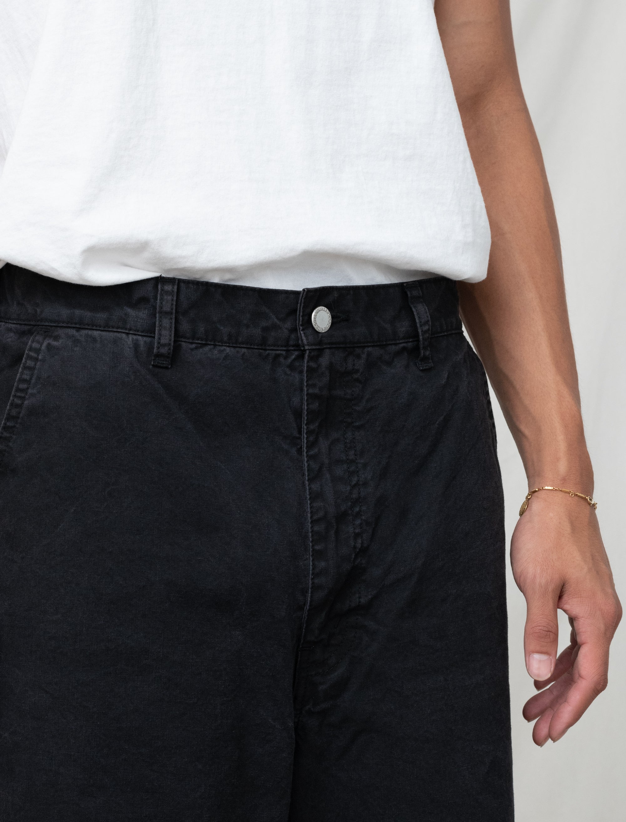 cotton black pants on person in front of white background