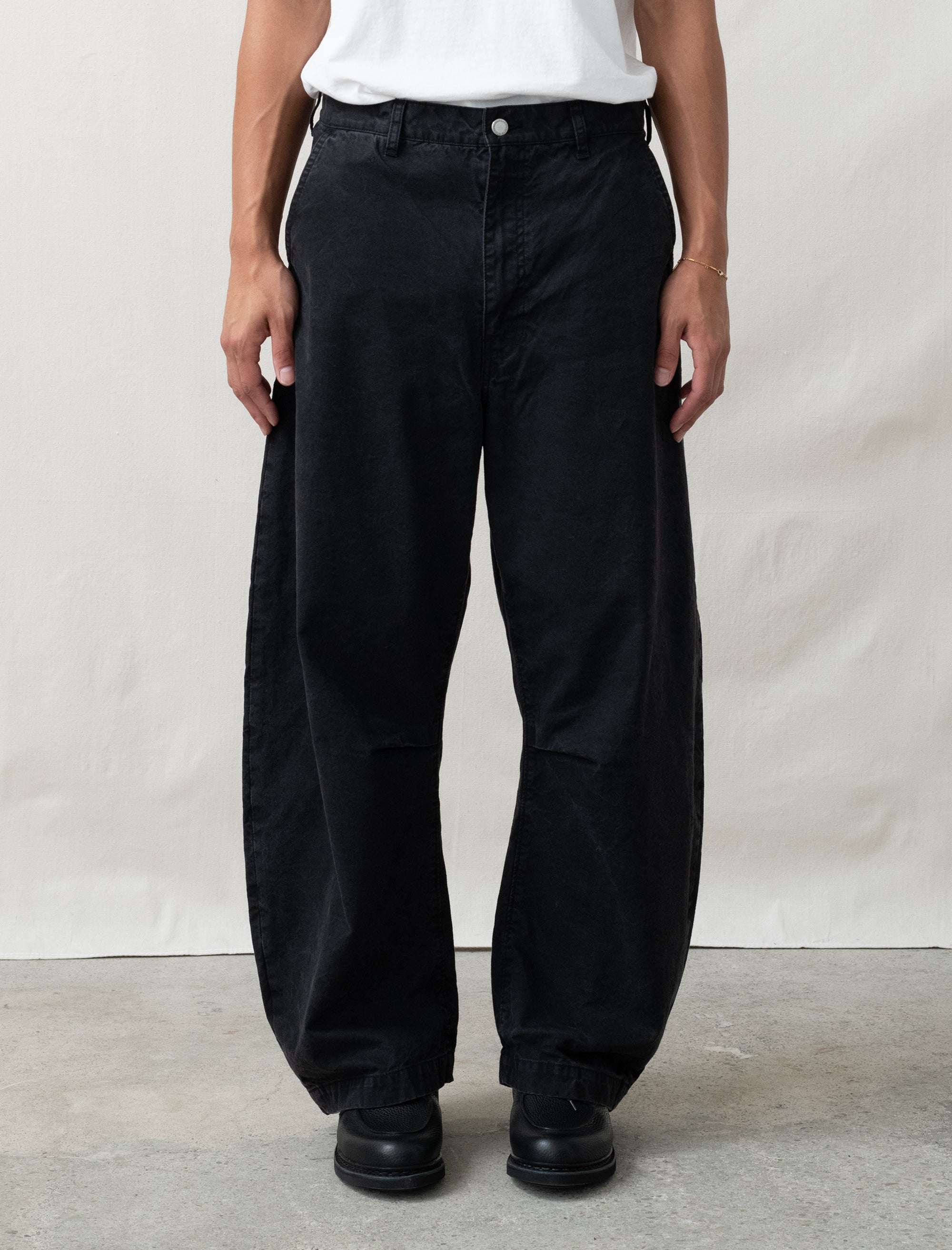 cotton black pants on person in front of white background