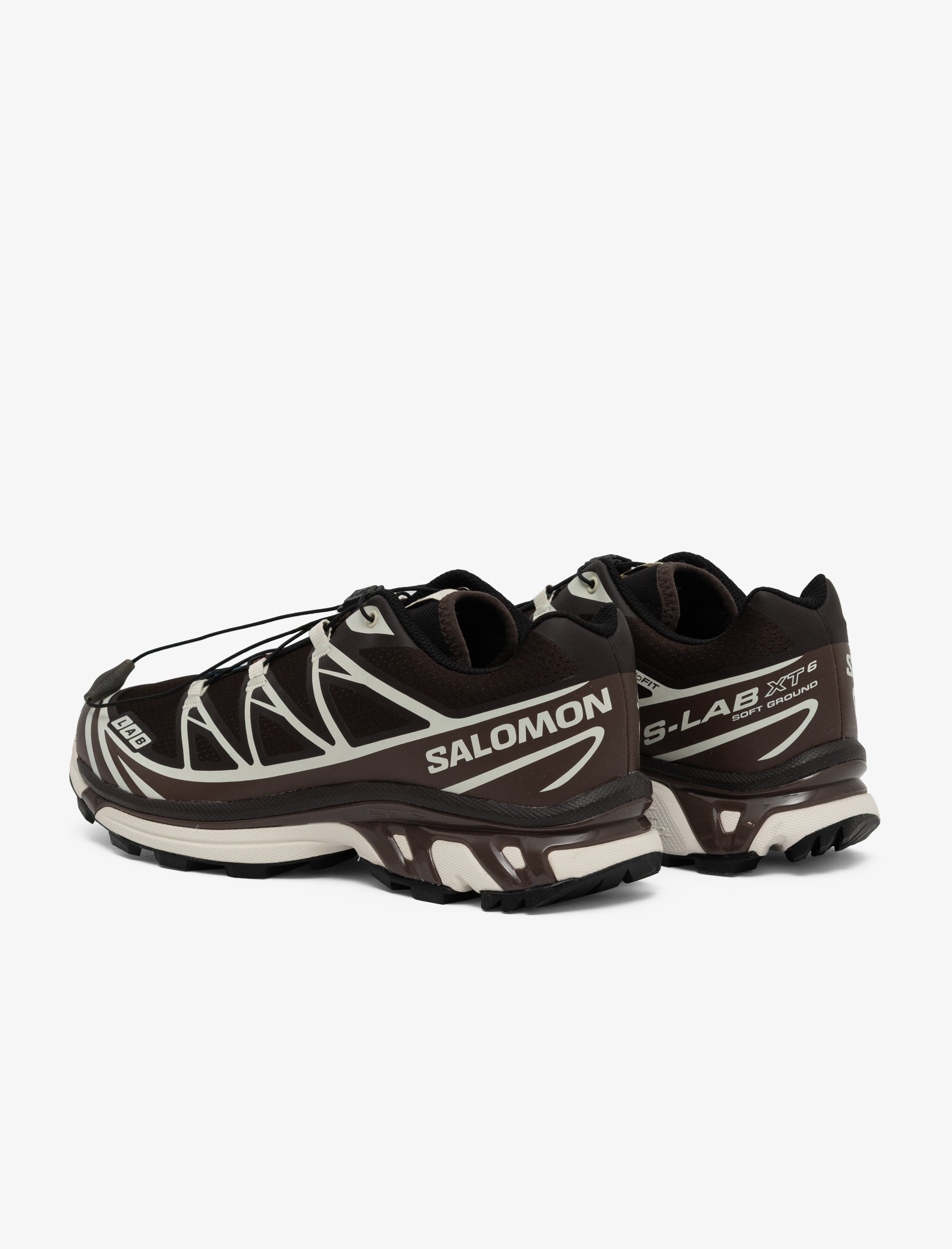 Black and white Salomon running shoes on a white background