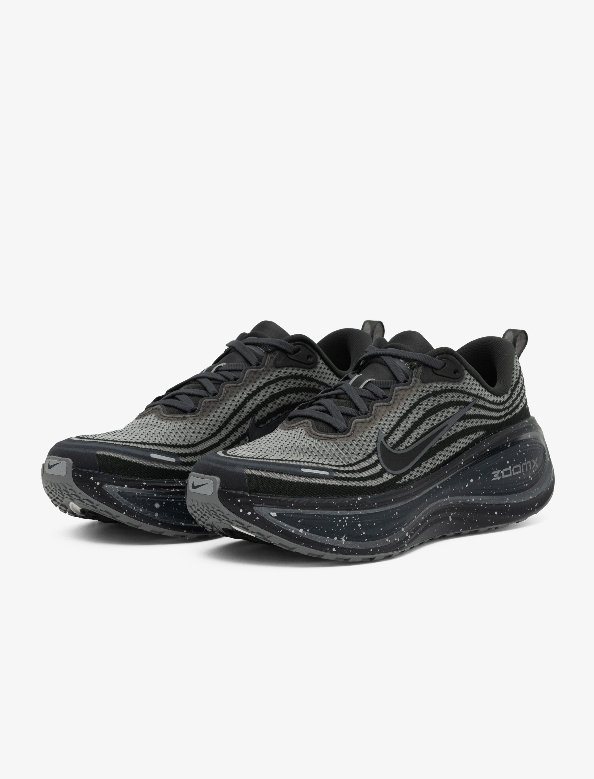 Black and gray athletic shoes on a white background