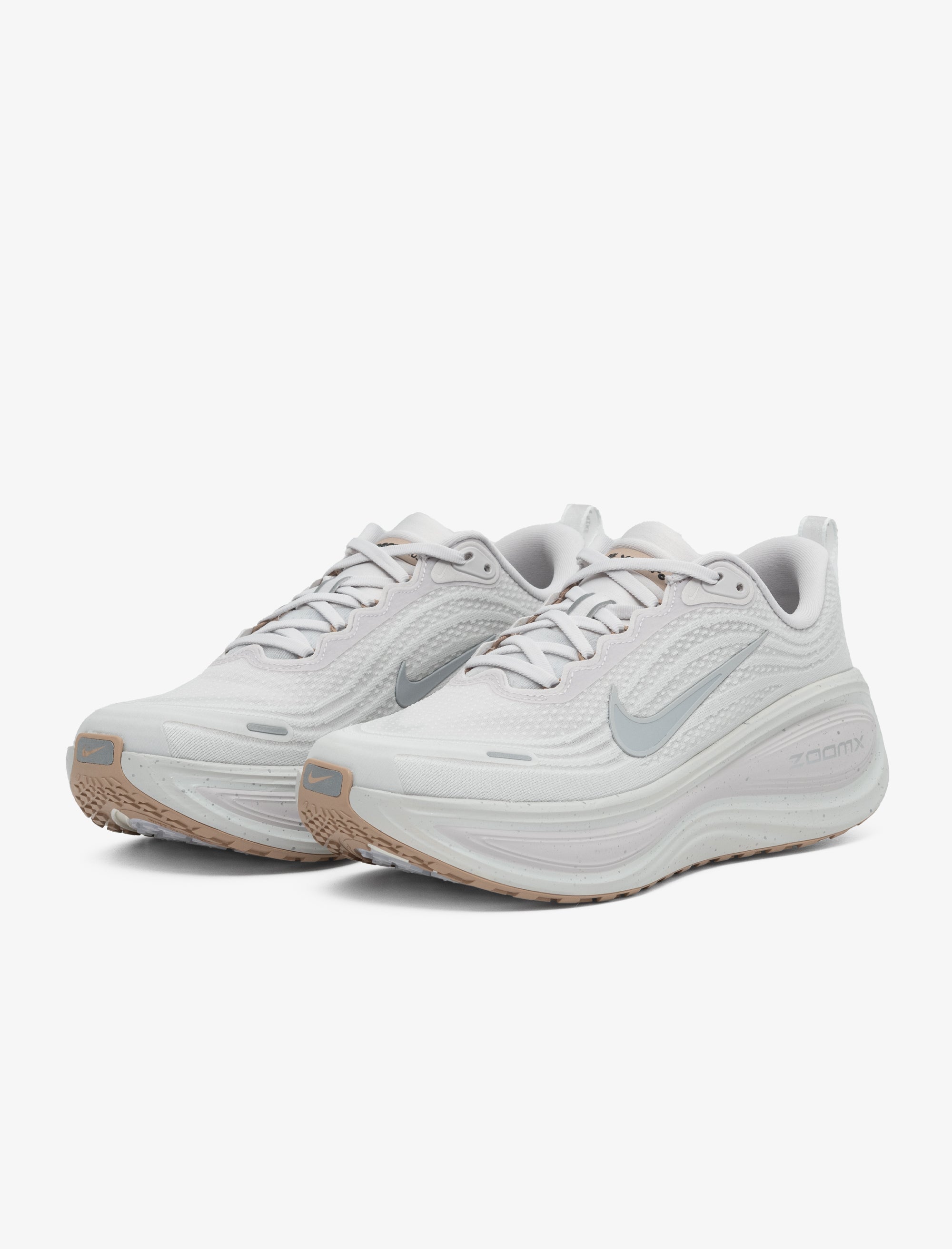 White running shoes with Nike logo on a white background